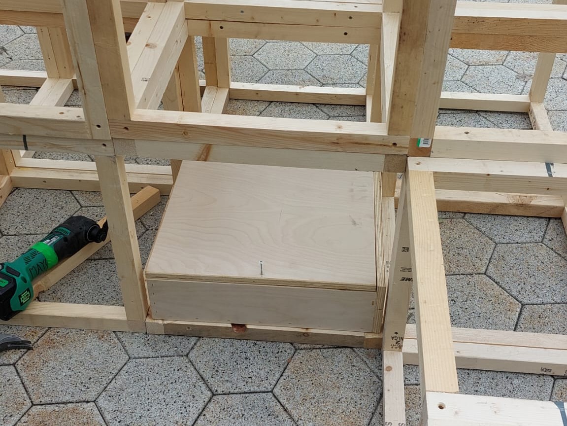 One electrical box tucked inside the frame of an island