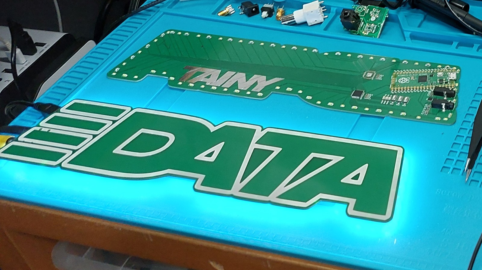 Completed board, assembled and lit up next to another face down