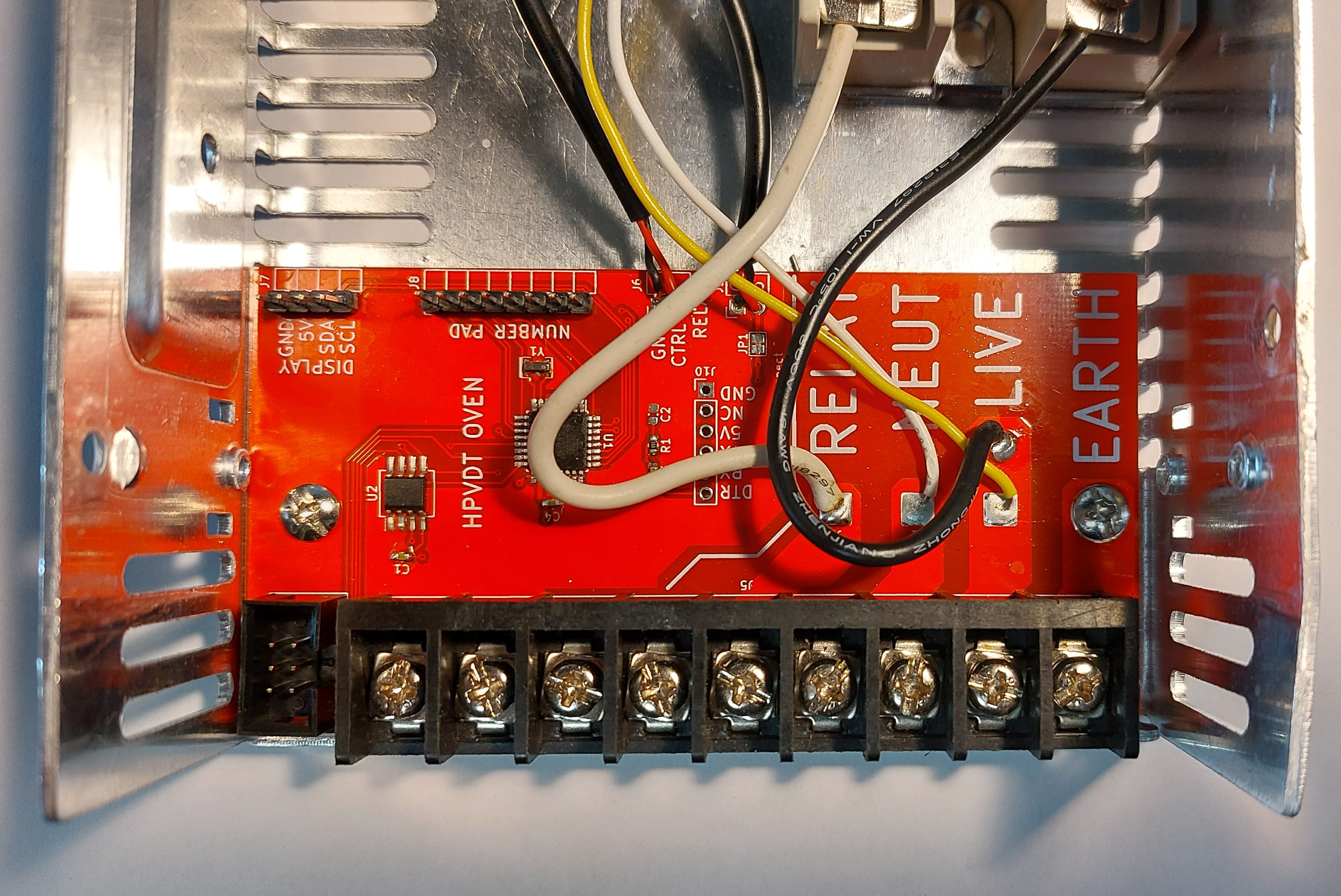 Circuit board assembled and in place, with all wires soldered too