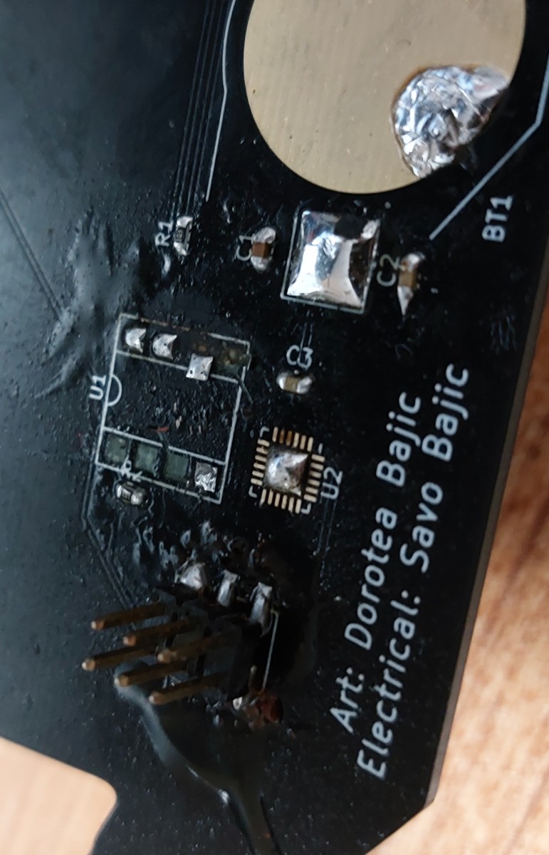 The puddle of flux on the original board