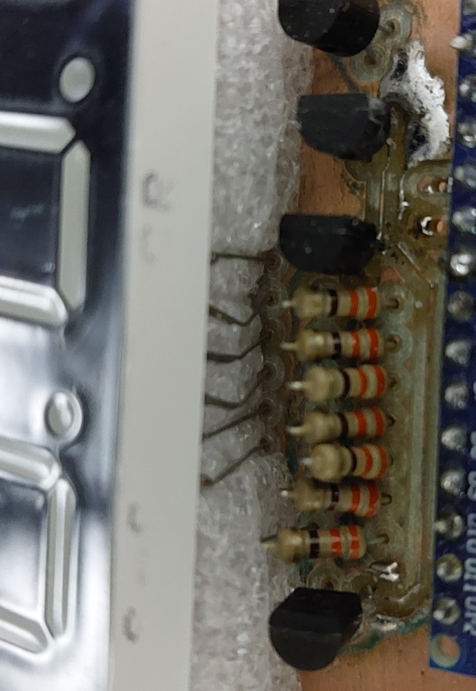 The &lsquo;custom&rsquo; pin job. The damaged ground trace for the MOSFETS is also visible snaking between the row of resistors and the Arduino