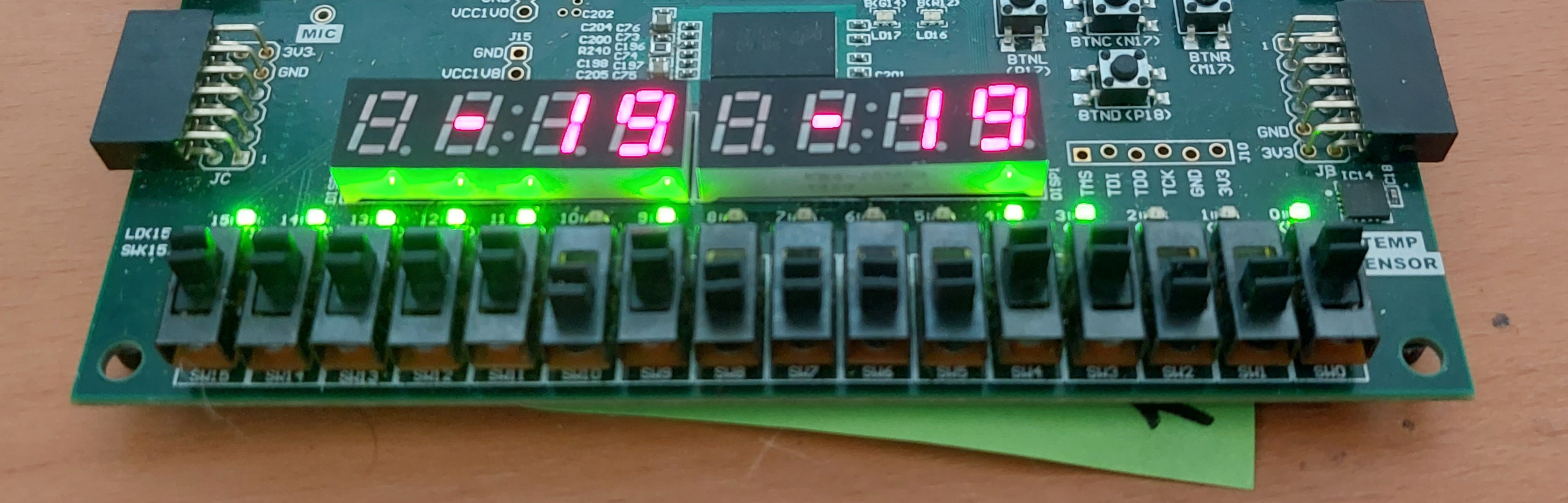 The seven segment displays working, their values set by the switches